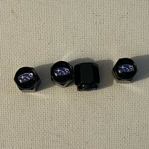 Subaru logo valve Stem caps in black set of 4 NWT